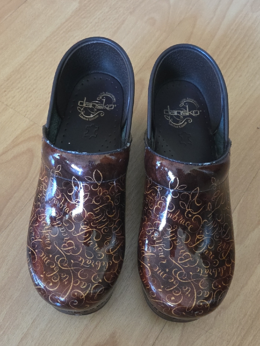 Dansko Brown Patent Clogs with Gold Script Accents